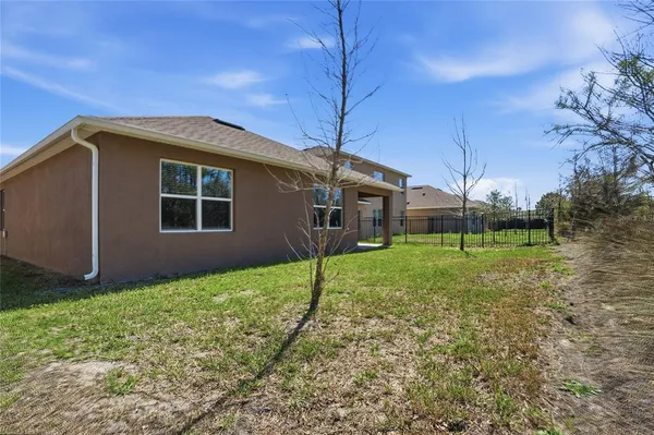 a living room with furniture wooden floor and a chandelier