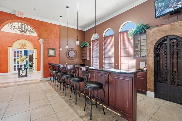 a living room with lots of furniture and a large window