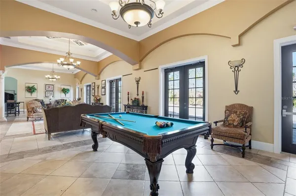 a view of a swimming pool with a lounge chairs