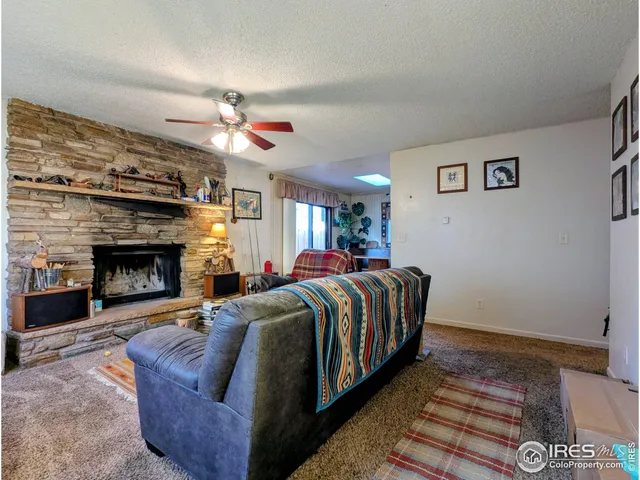 a living room with furniture fireplace and flat screen tv