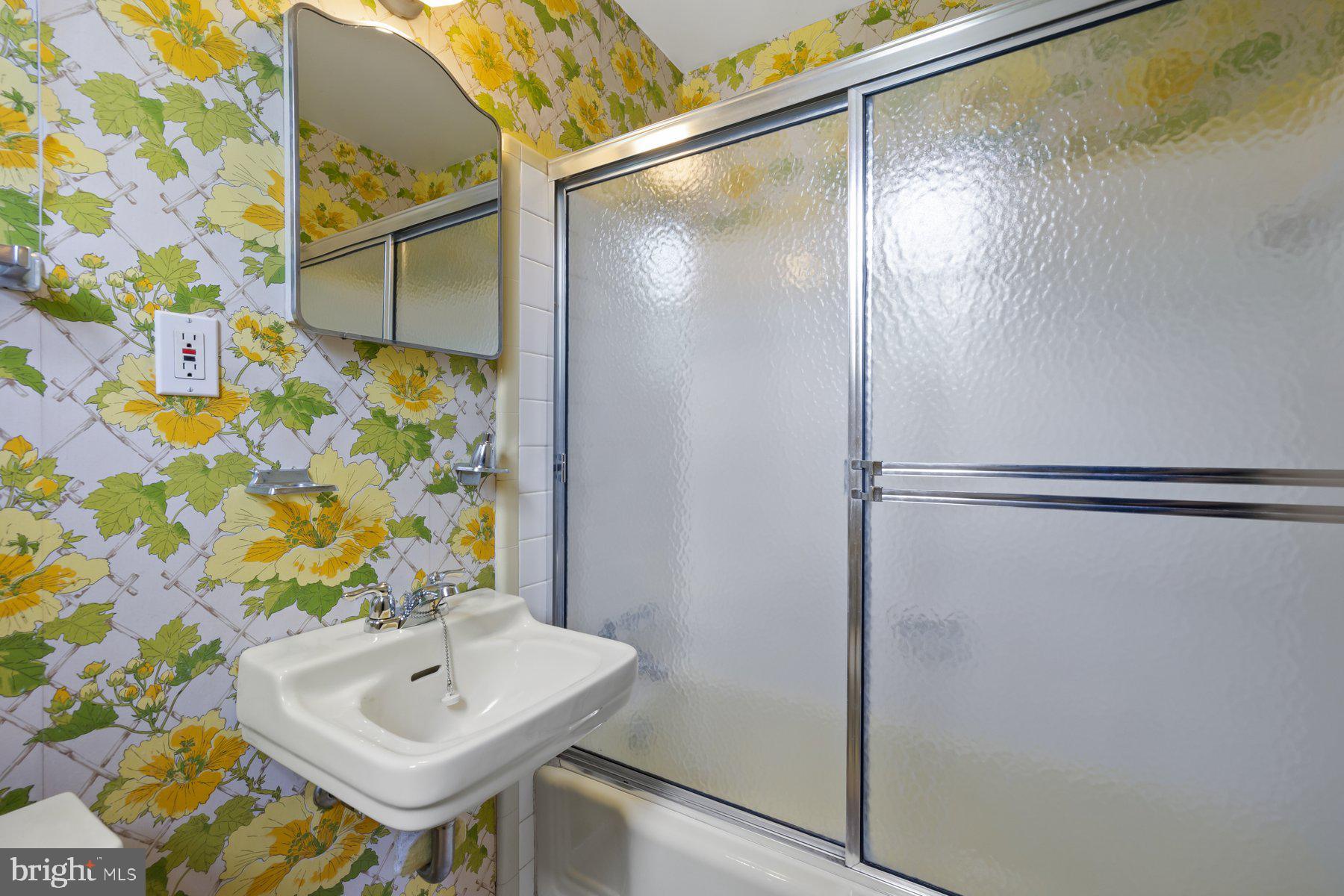 5304 Moultrie Road Springfield, VA 22151 - Photo 30 of 38 a bathroom with a sink and shower