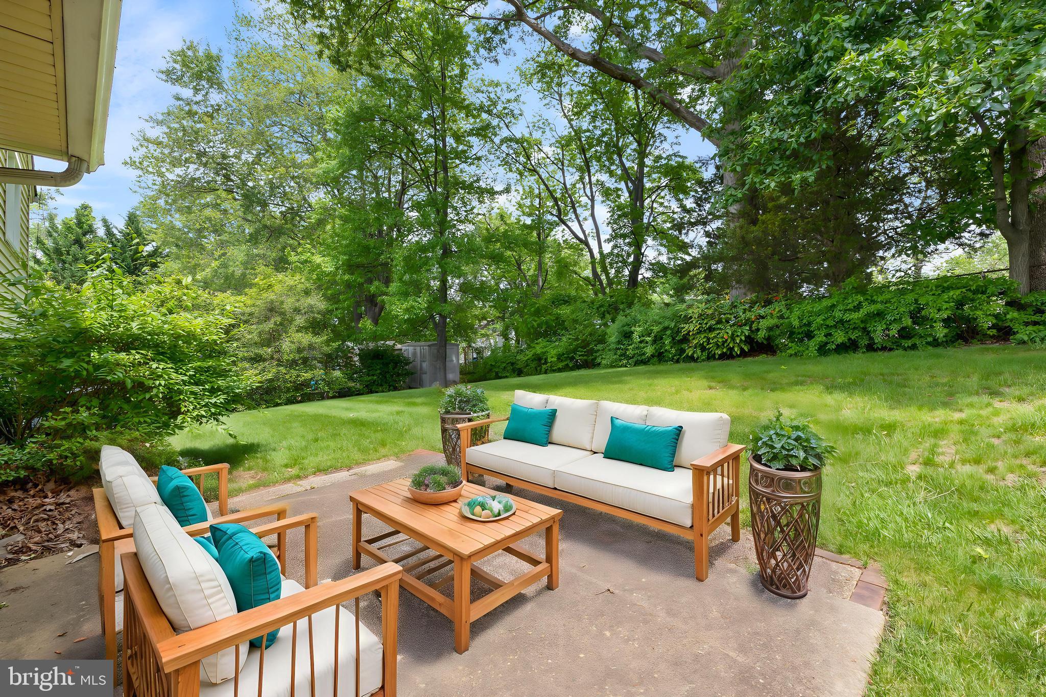 5304 Moultrie Road Springfield, VA 22151 - Photo 32 of 38 a view of a patio with couches chairs and a yard