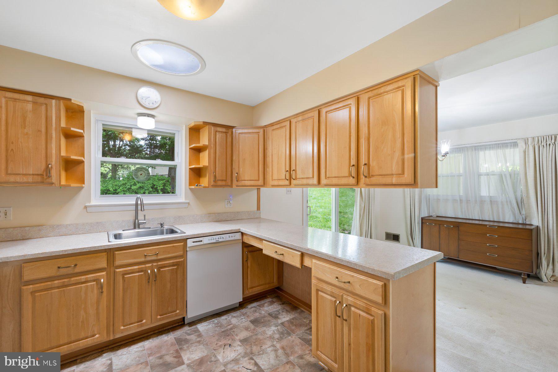 5304 Moultrie Road Springfield, VA 22151 - Photo 9 of 38 a kitchen with a sink stove and cabinets