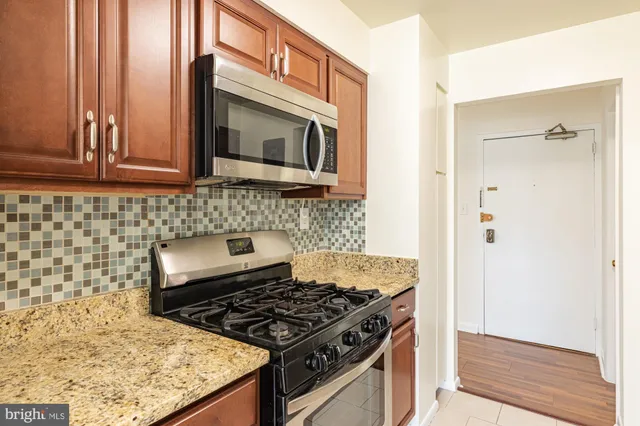 a kitchen with a stove and a microwave