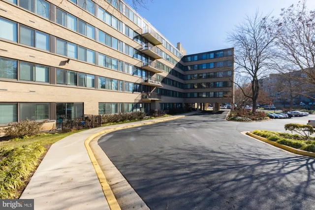 a swimming pool with buildings in the background