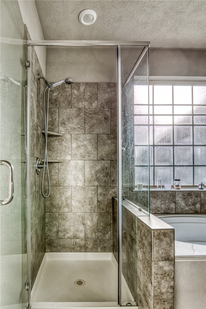 1827 Basin Trail Brenham, TX 77833 - Photo 16 of 38 a bathroom with a shower and a sink