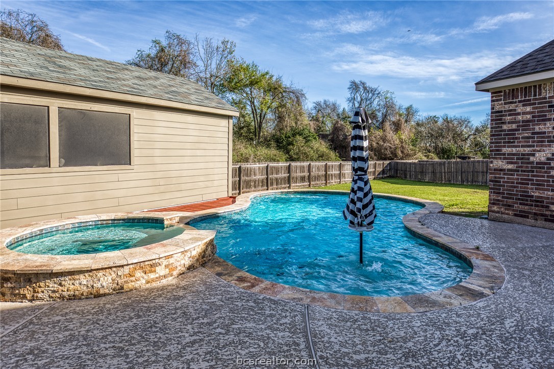 1827 Basin Trail Brenham, TX 77833 - Photo 2 of 38 a view of a swimming pool with a patio