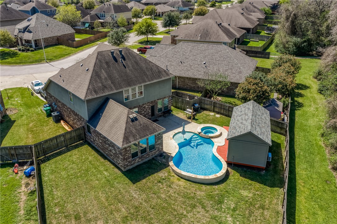 1827 Basin Trail Brenham, TX 77833 - Photo 33 of 38 an aerial view of a house with a garden and pool