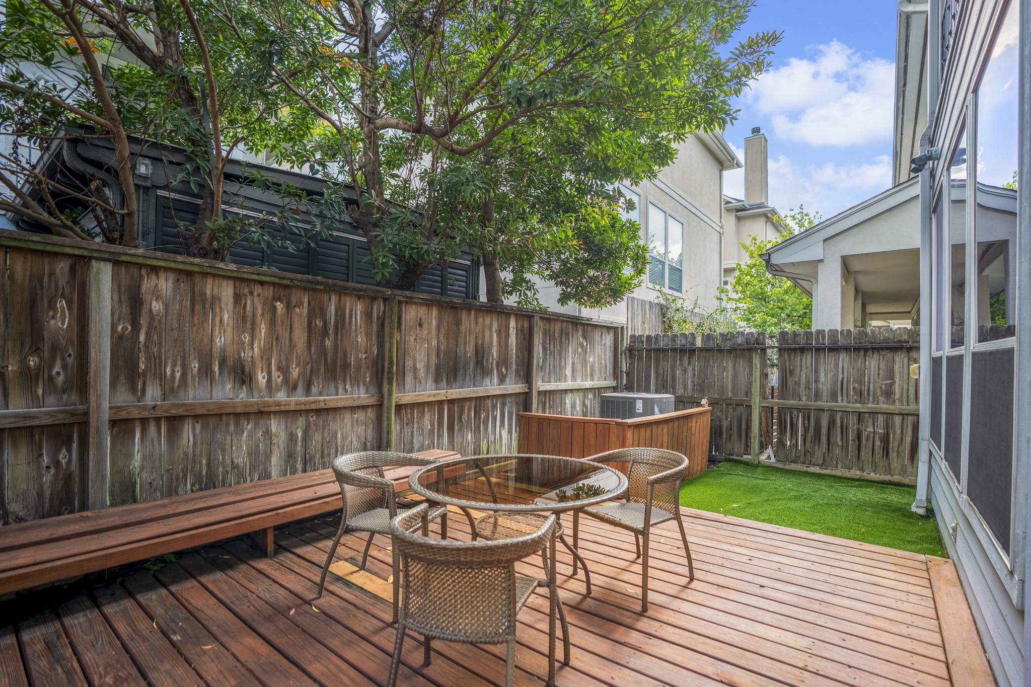 4236 Drake Street Houston, TX 77005 - Photo 39 of 43 Private backyard retreat featuring a generous wood deck, low-maintenance turf, and a great outdoor space for relaxing and entertaining.