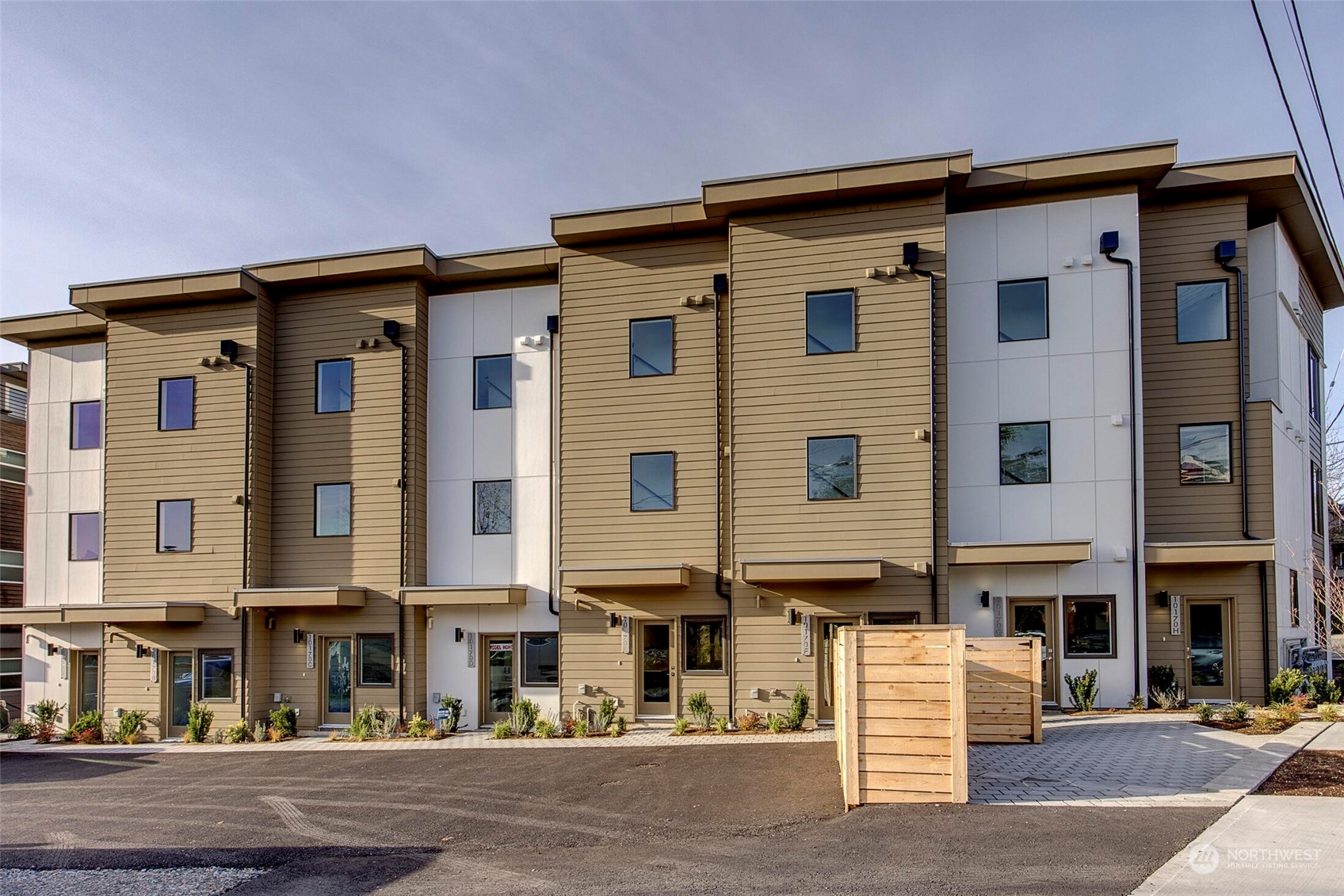 10170 Holman Road Northwest, Unit F Seattle, WA 98133 - Photo 1 of 22 a front view of a building with street