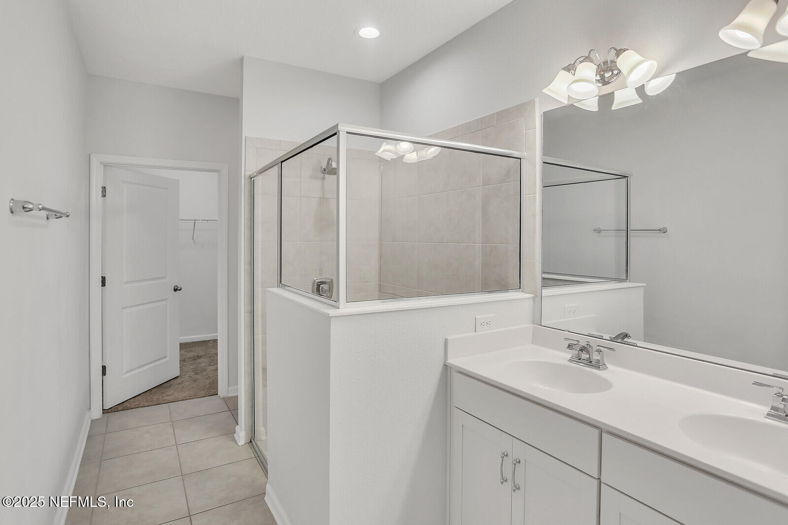 133 Leeward Island Drive St. Augustine, FL 32080 - Photo 13 of 48 a bathroom with a sink vanity and a mirror