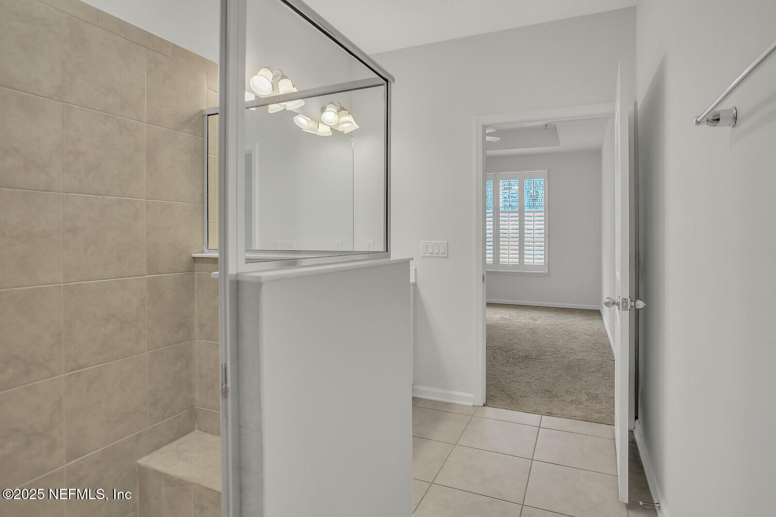 133 Leeward Island Drive St. Augustine, FL 32080 - Photo 14 of 48 a bathroom with a glass shower door and a bathroom sink