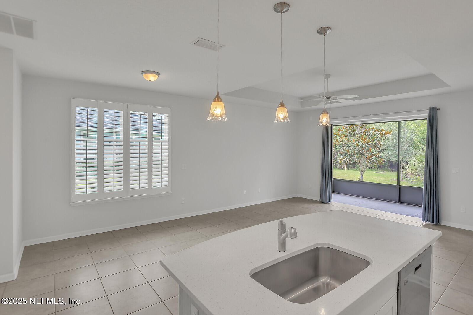 133 Leeward Island Drive St. Augustine, FL 32080 - Photo 16 of 48 a kitchen with a sink window and cabinets