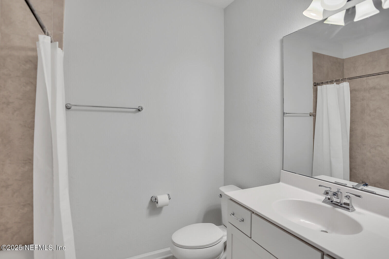 133 Leeward Island Drive St. Augustine, FL 32080 - Photo 23 of 48 a bathroom with a sink toilet and vanity