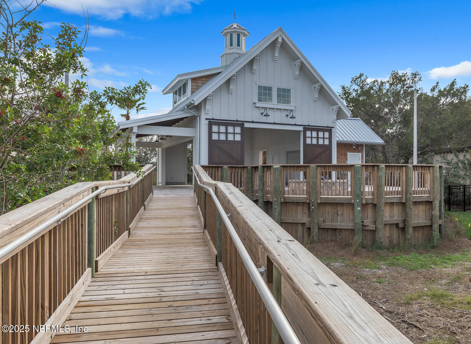 133 Leeward Island Drive St. Augustine, FL 32080 - Photo 29 of 48 a view of a wooden house with a small yard