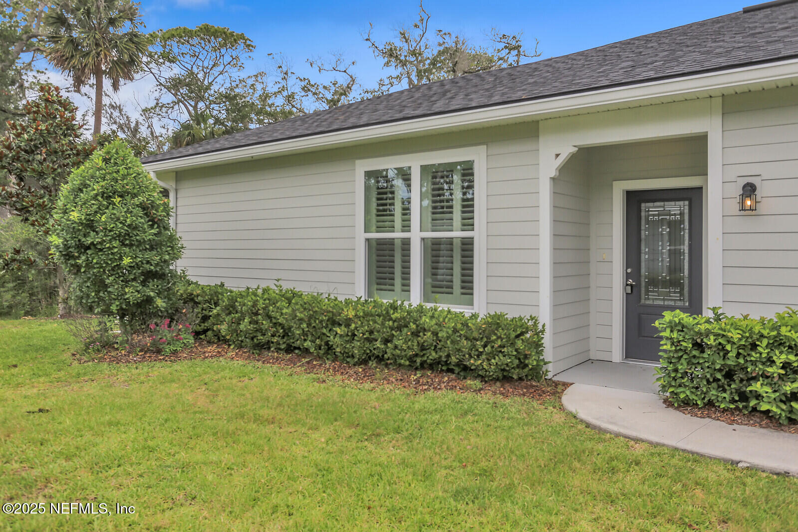 133 Leeward Island Drive St. Augustine, FL 32080 - Photo 3 of 48 a front view of a house with garden