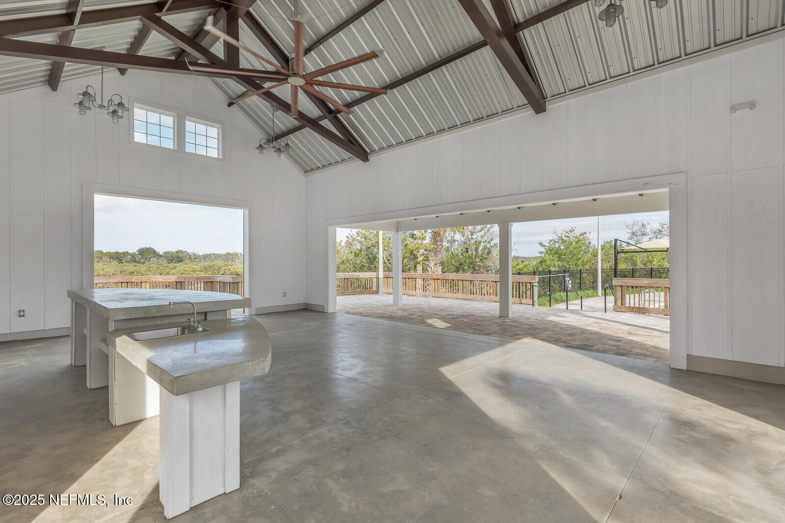 133 Leeward Island Drive St. Augustine, FL 32080 - Photo 39 of 48 a view of a kitchen with furniture and floor to ceiling window