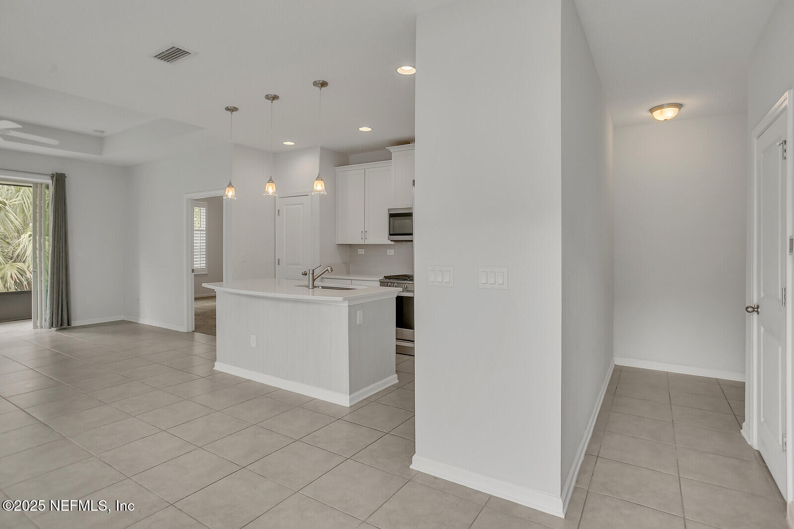133 Leeward Island Drive St. Augustine, FL 32080 - Photo 4 of 48 a view of a kitchen with white cabinets