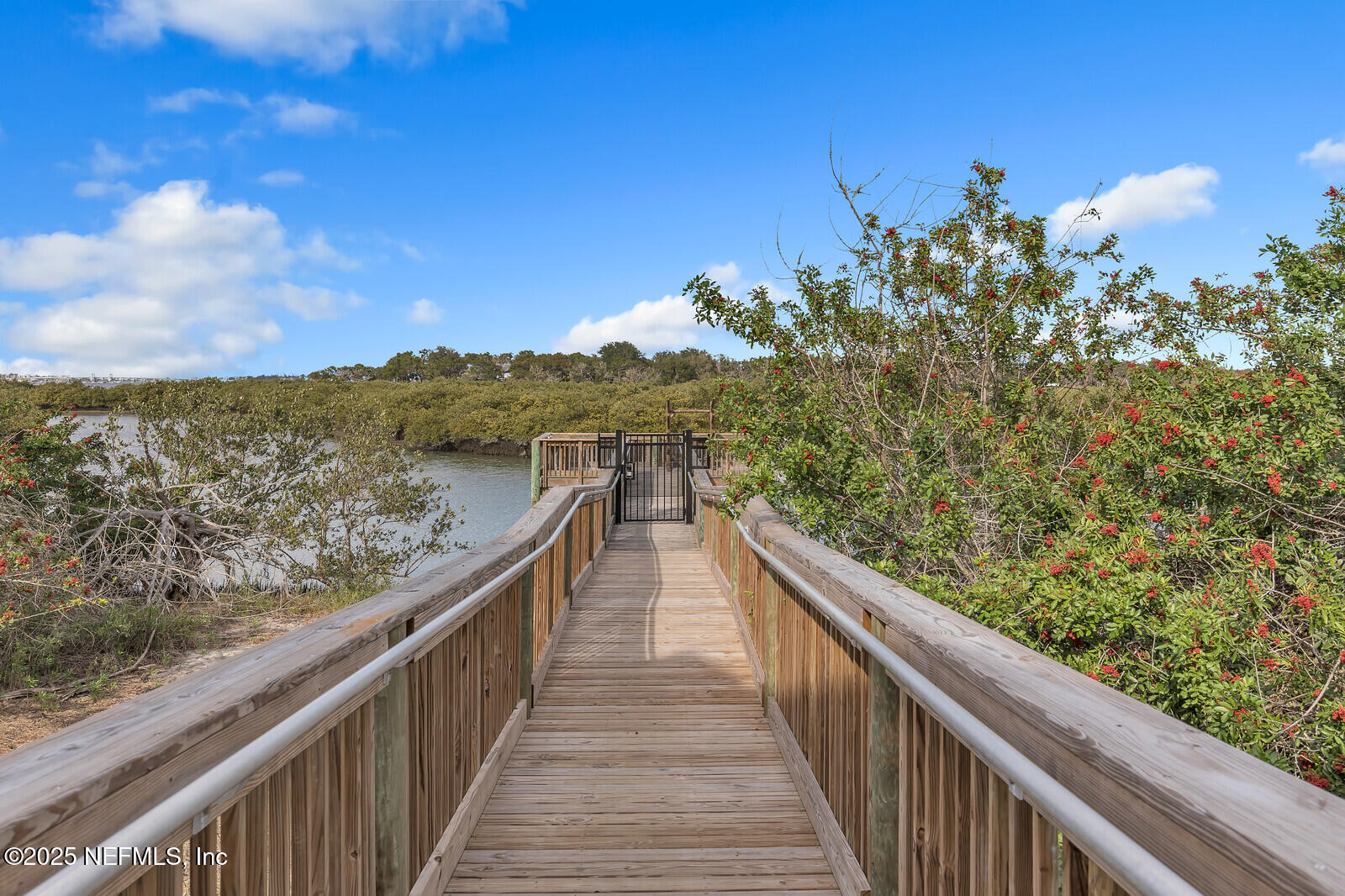 133 Leeward Island Drive St. Augustine, FL 32080 - Photo 43 of 48 a view of a balcony with wooden floor and fence