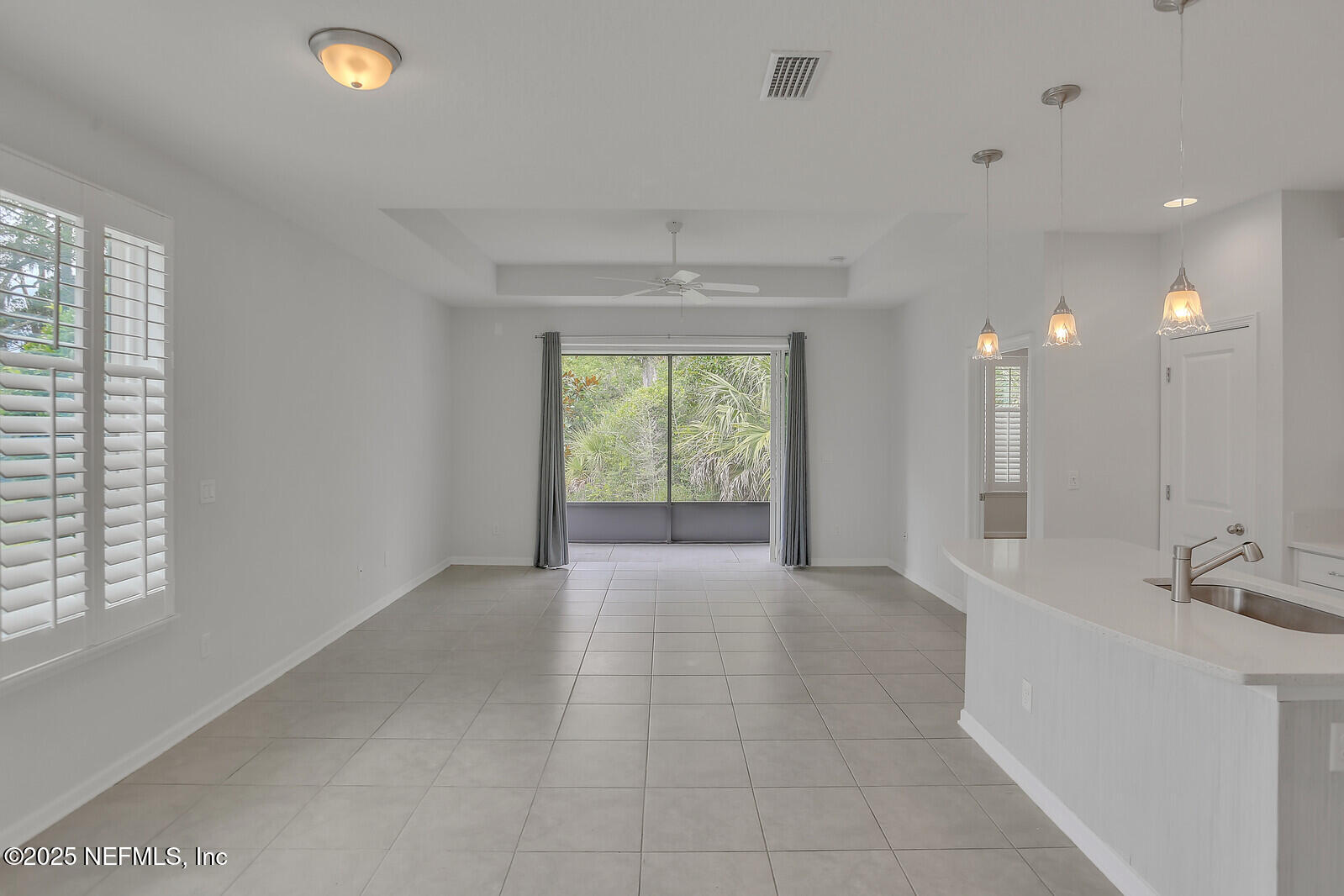 133 Leeward Island Drive St. Augustine, FL 32080 - Photo 5 of 48 a bathroom with a sink a large mirror and a shower