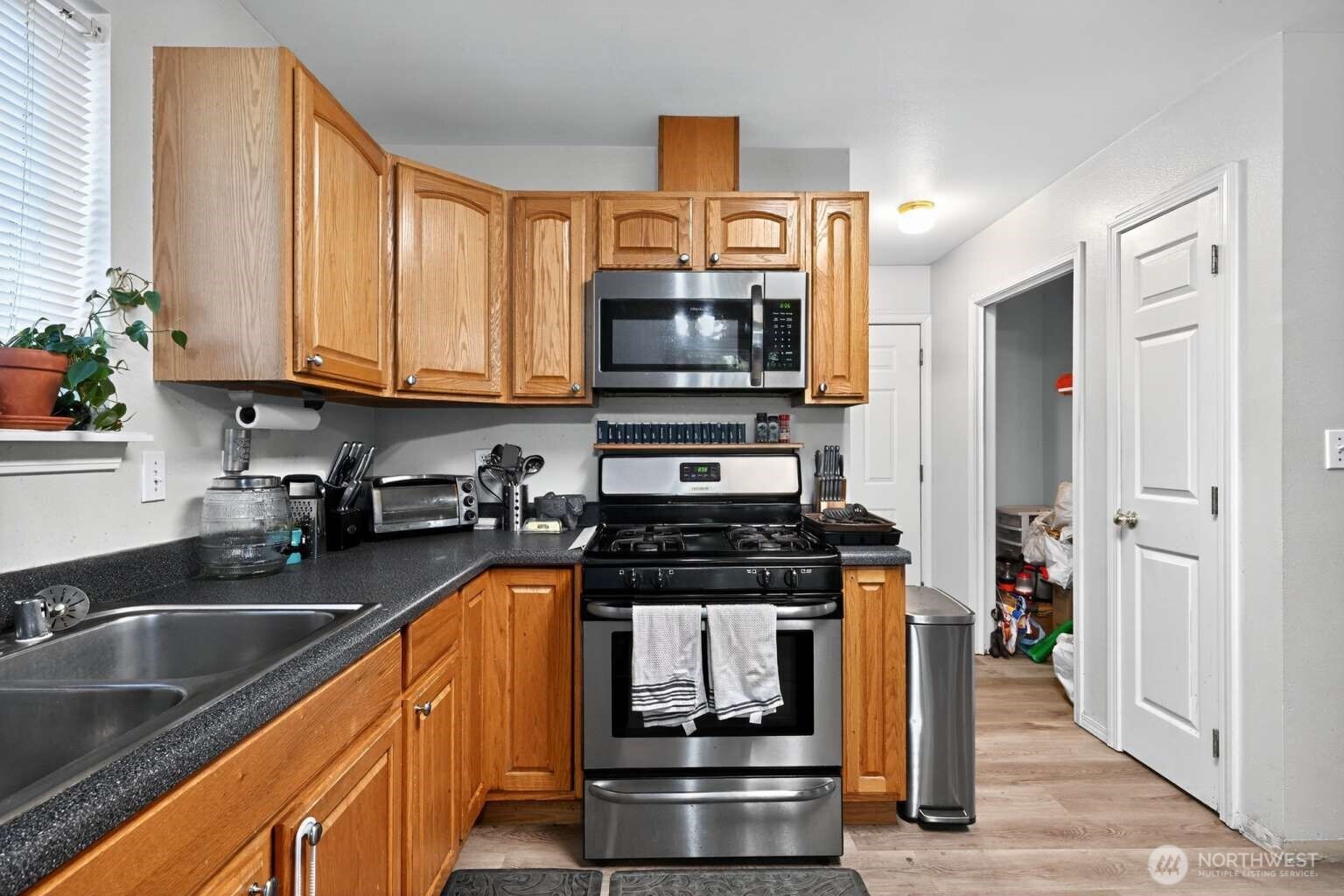 2972 Brook Lane Sedro-Woolley, WA 98284 - Photo 11 of 35 a kitchen with stainless steel appliances granite countertop a stove and a sink