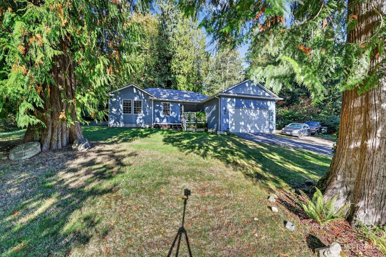 2972 Brook Lane Sedro-Woolley, WA 98284 - Photo 30 of 35 a view of a large house with a big yard plants and large trees