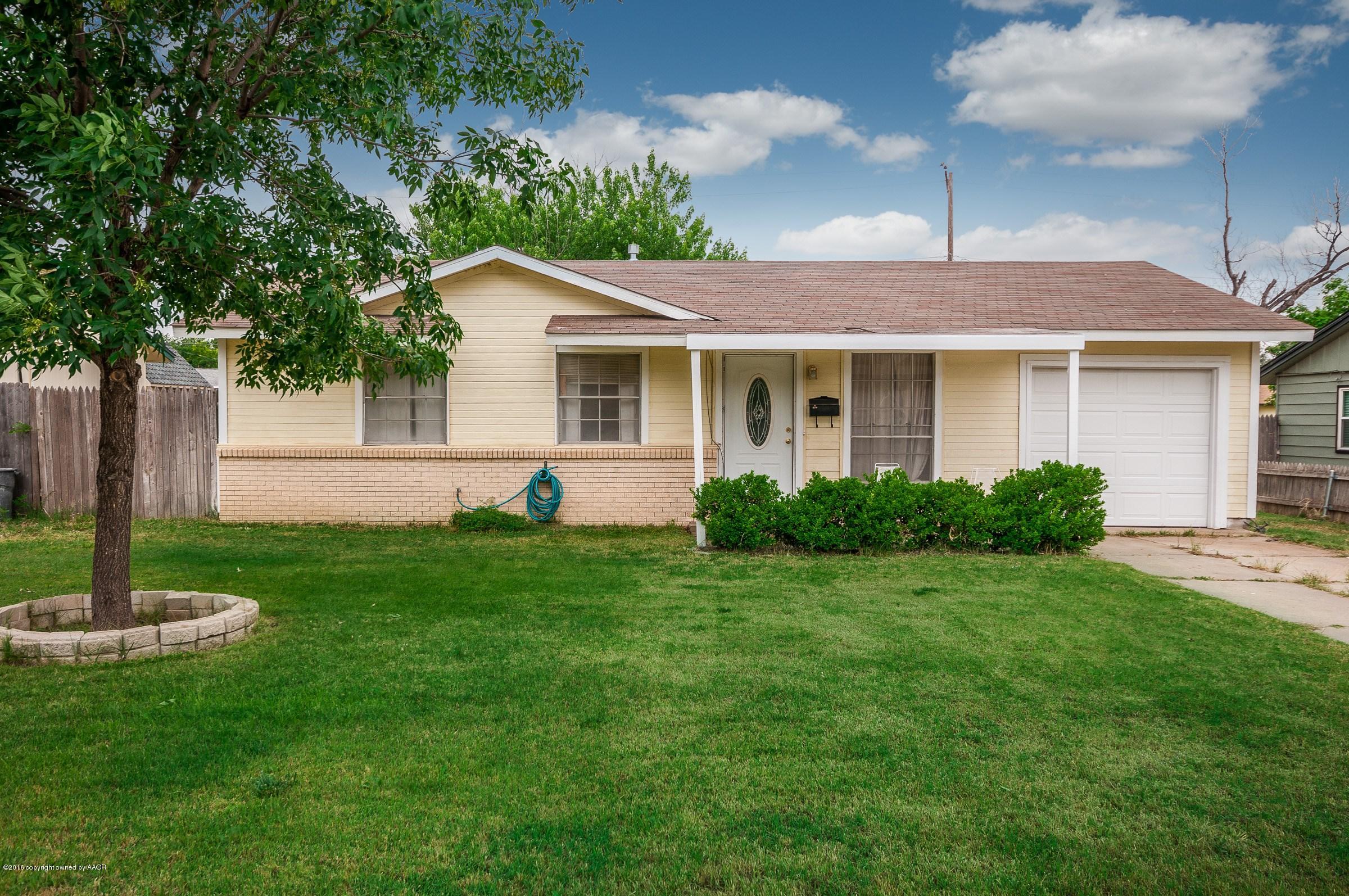 5312 Parker Street Amarillo, TX 79110 - Photo 1 of 13 a front view of house with a garden