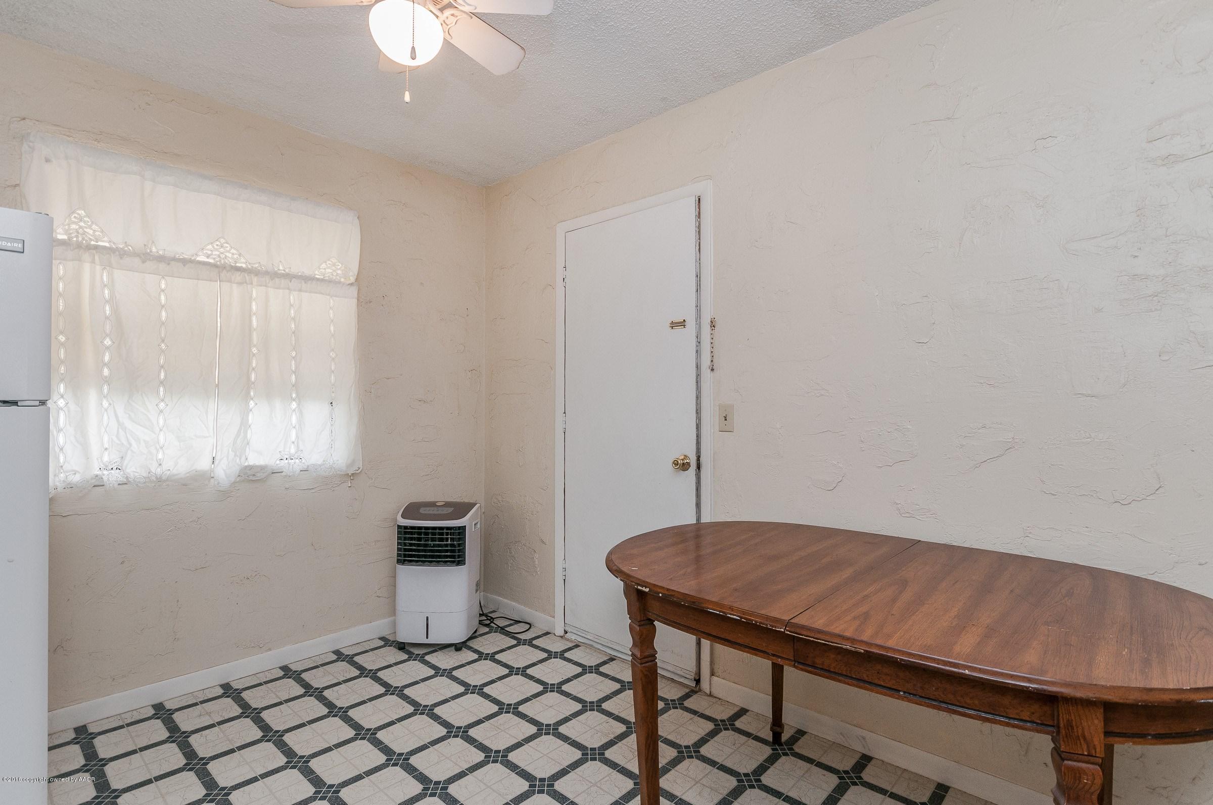 5312 Parker Street Amarillo, TX 79110 - Photo 4 of 13 a room with a table and a window
