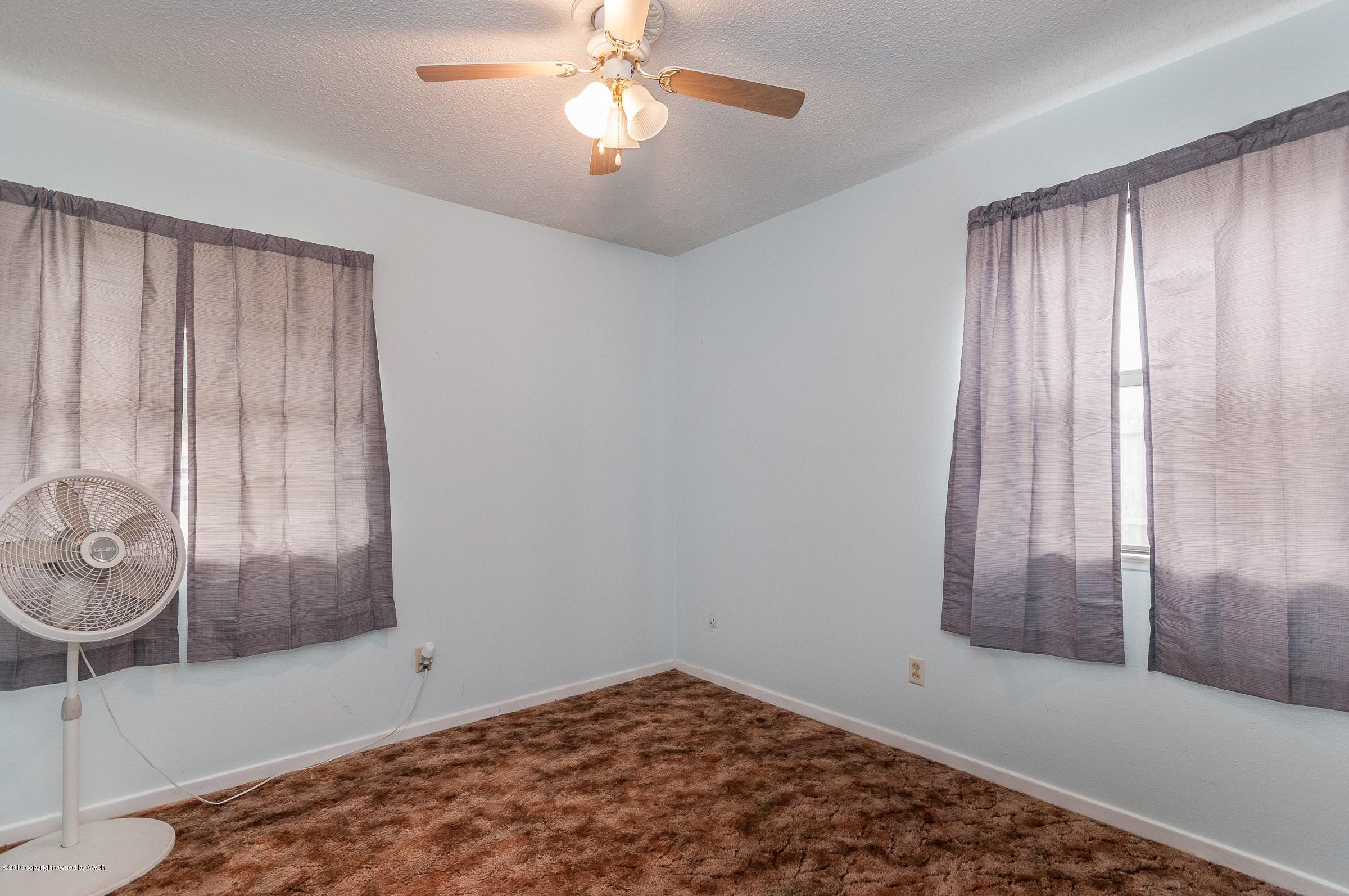 5312 Parker Street Amarillo, TX 79110 - Photo 9 of 13 a view of an empty room with a window