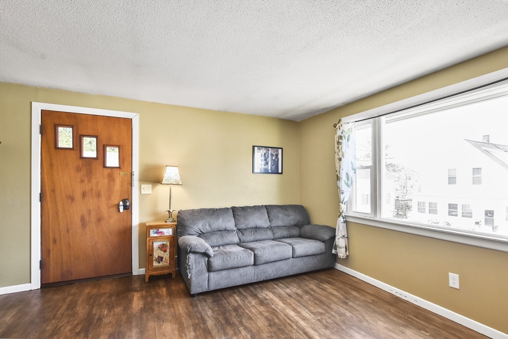 23 Harold Street Worcester, MA 01604 - Photo 13 of 32 a living room with furniture and a large window