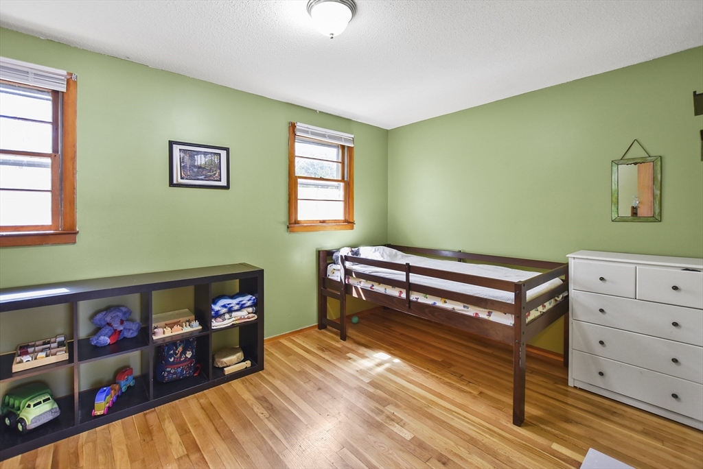 23 Harold Street Worcester, MA 01604 - Photo 17 of 32 a bedroom with furniture and a wooden floor