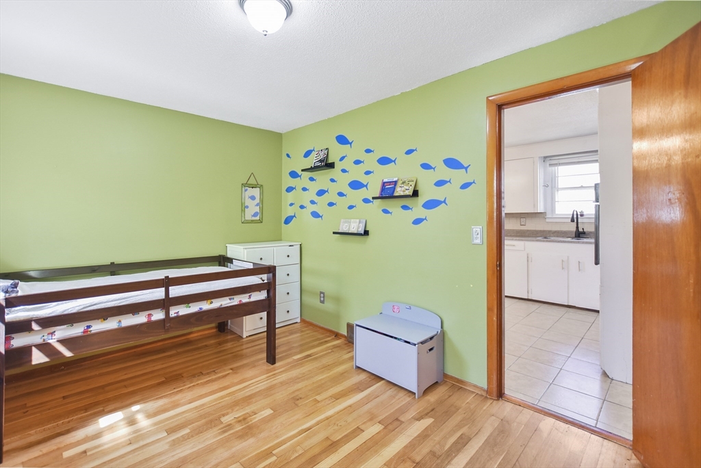 23 Harold Street Worcester, MA 01604 - Photo 18 of 32 a room with furniture and a wooden floor