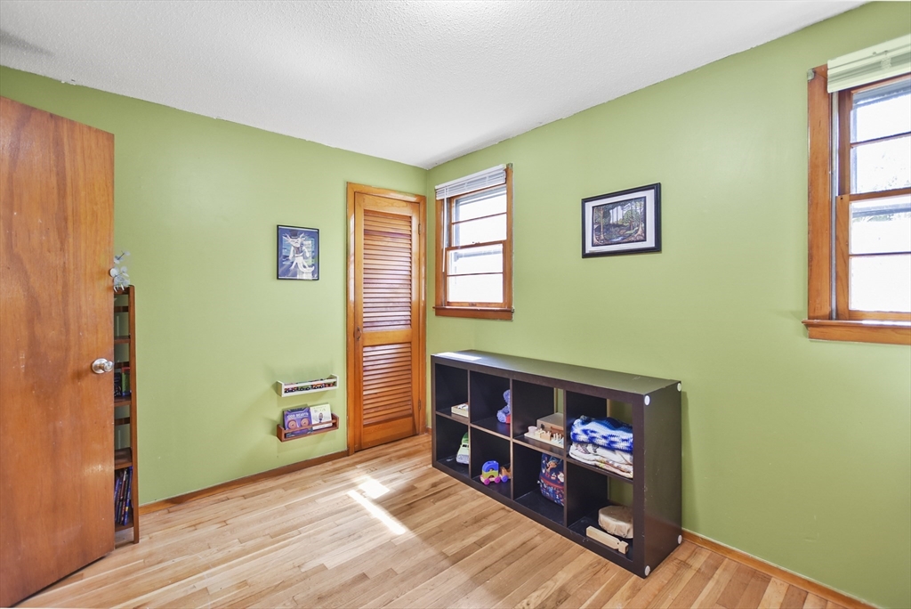 23 Harold Street Worcester, MA 01604 - Photo 19 of 32 a view of a livingroom with wooden floor and a fireplace