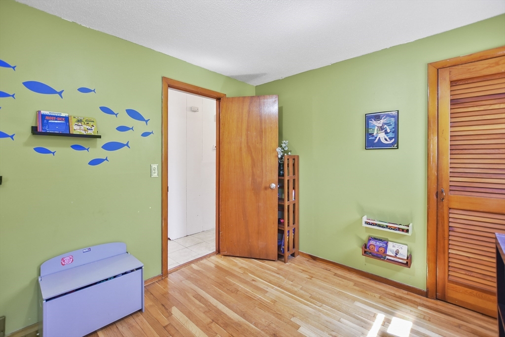 23 Harold Street Worcester, MA 01604 - Photo 20 of 32 a bedroom with a bed and a window