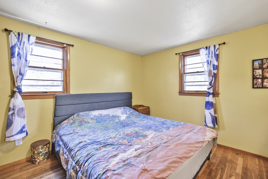23 Harold Street Worcester, MA 01604 - Photo 21 of 32 a bedroom with a bed and a window