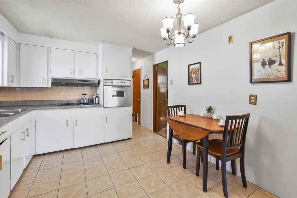 23 Harold Street Worcester, MA 01604 - Photo 8 of 32 a view of a dining room with furniture and chandelier