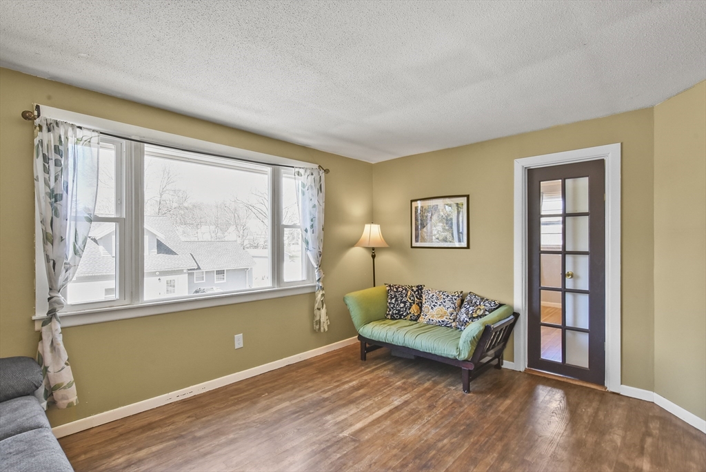 23 Harold Street Worcester, MA 01604 - Photo 10 of 32 a living room with furniture and a large window