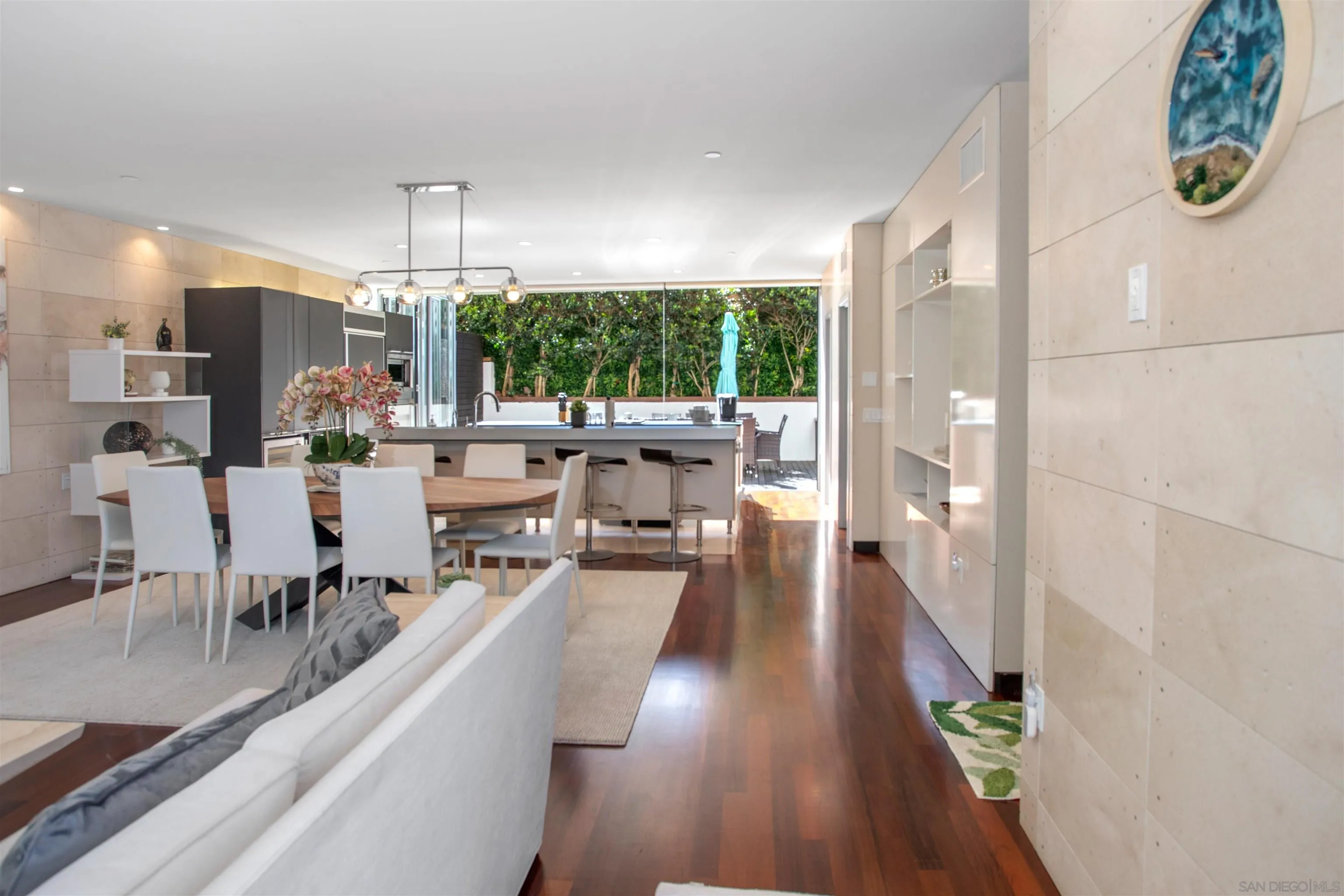 an open kitchen with dining table and chairs