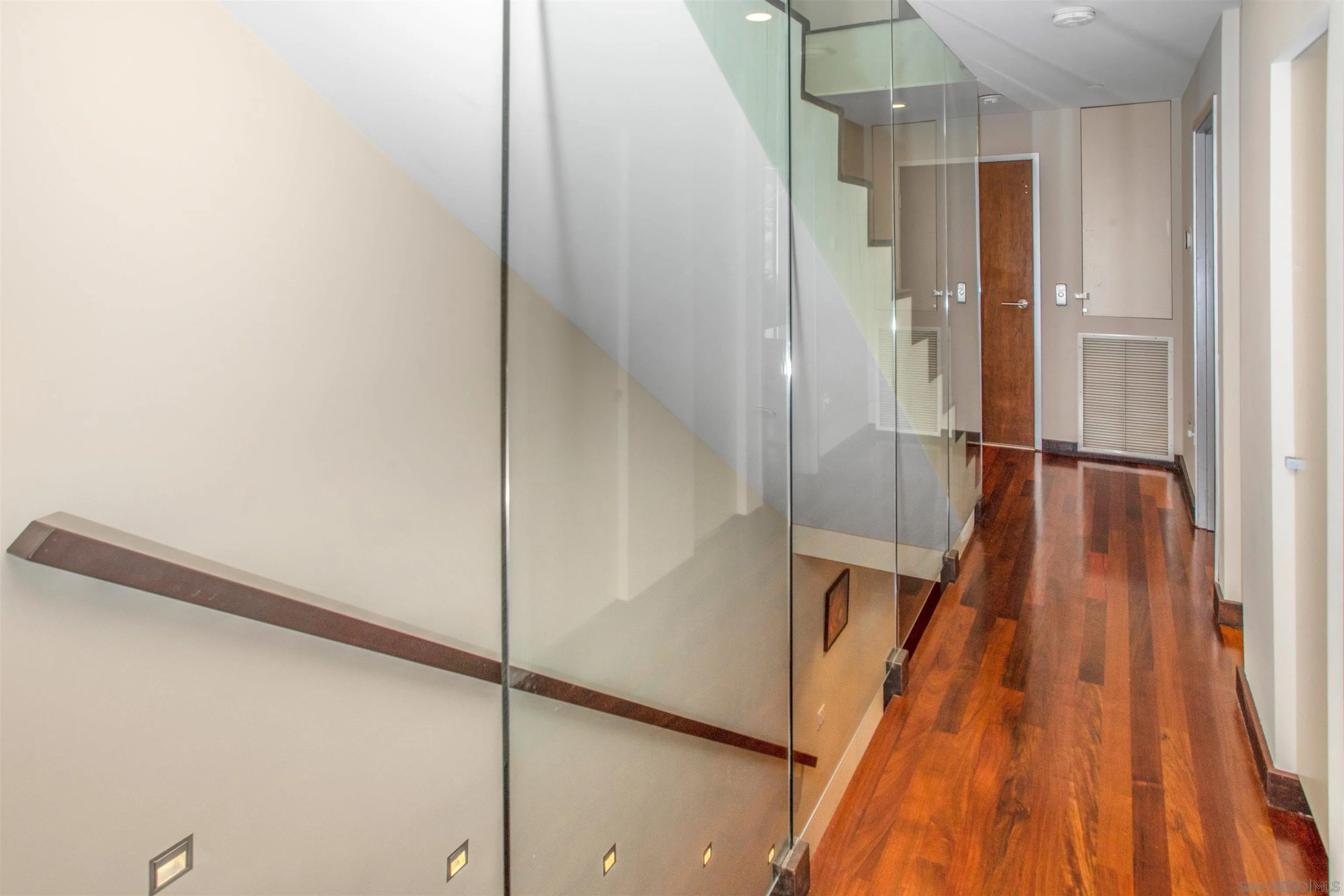 427 Ravina Street La Jolla, CA 92037 - Photo 12 of 36 a walk in closet with wooden floor