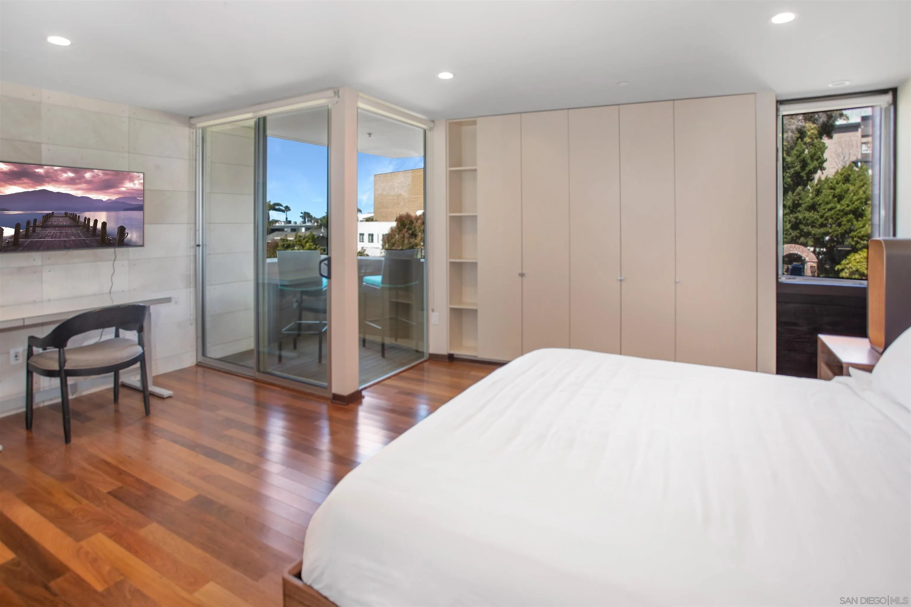 427 Ravina Street La Jolla, CA 92037 - Photo 14 of 36 a bedroom with a bed and a potted plant