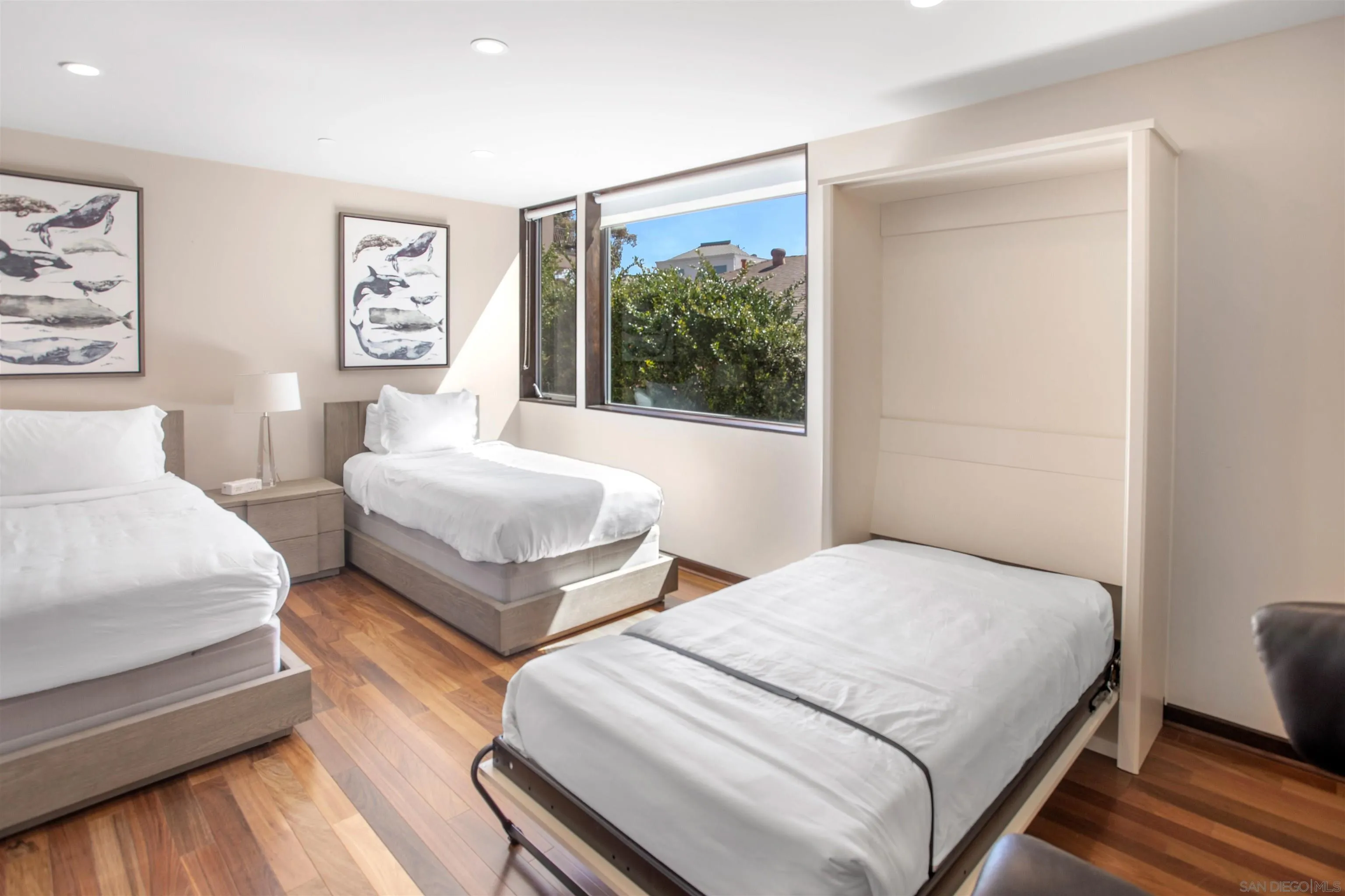 427 Ravina Street La Jolla, CA 92037 - Photo 16 of 36 a bedroom with two beds and a large window