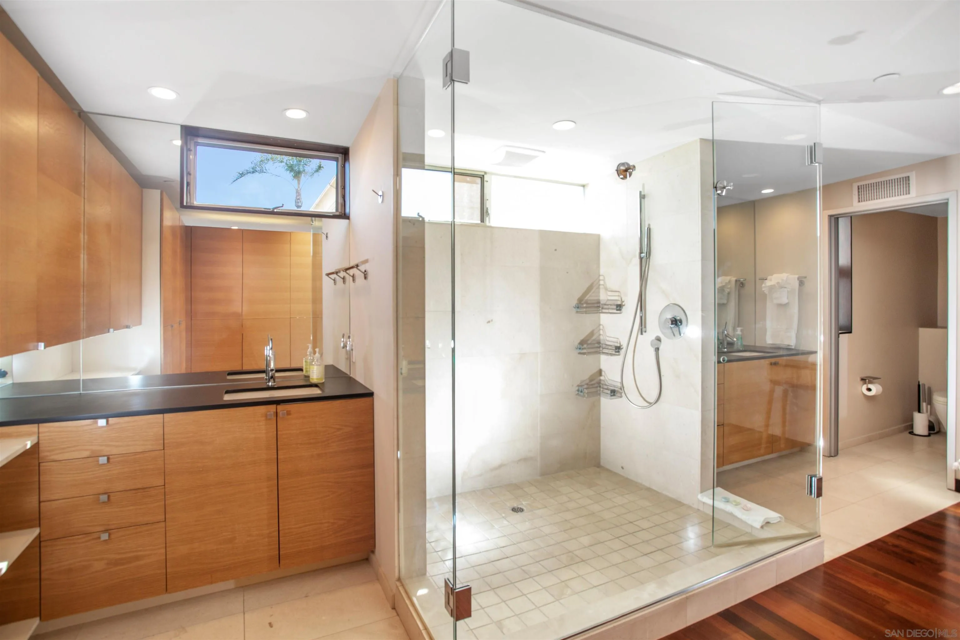 427 Ravina Street La Jolla, CA 92037 - Photo 23 of 36 a bathroom with a granite countertop sink mirror and shower