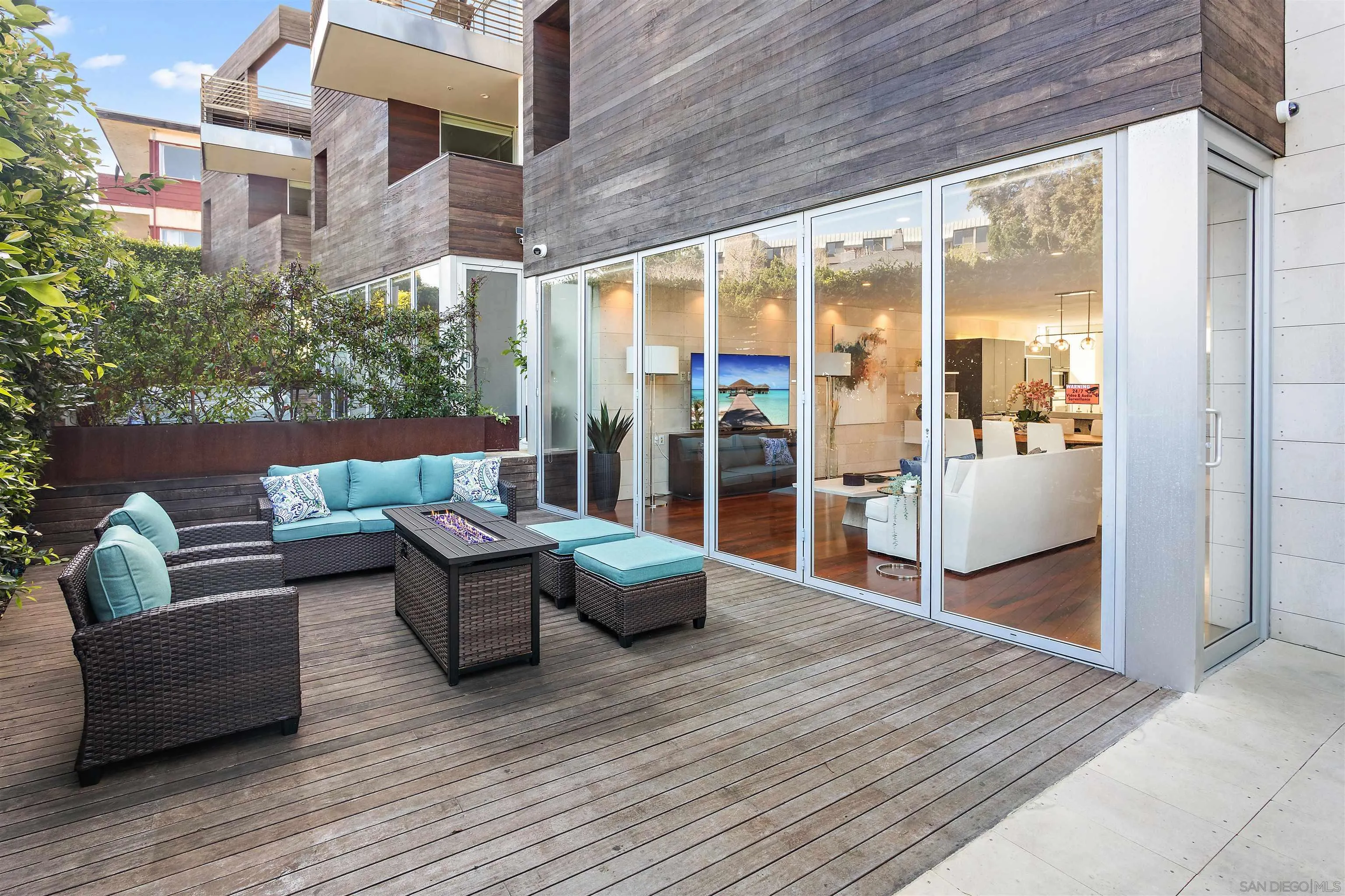 427 Ravina Street La Jolla, CA 92037 - Photo 24 of 36 a outdoor space with patio the couches and a dining table with wooden floor