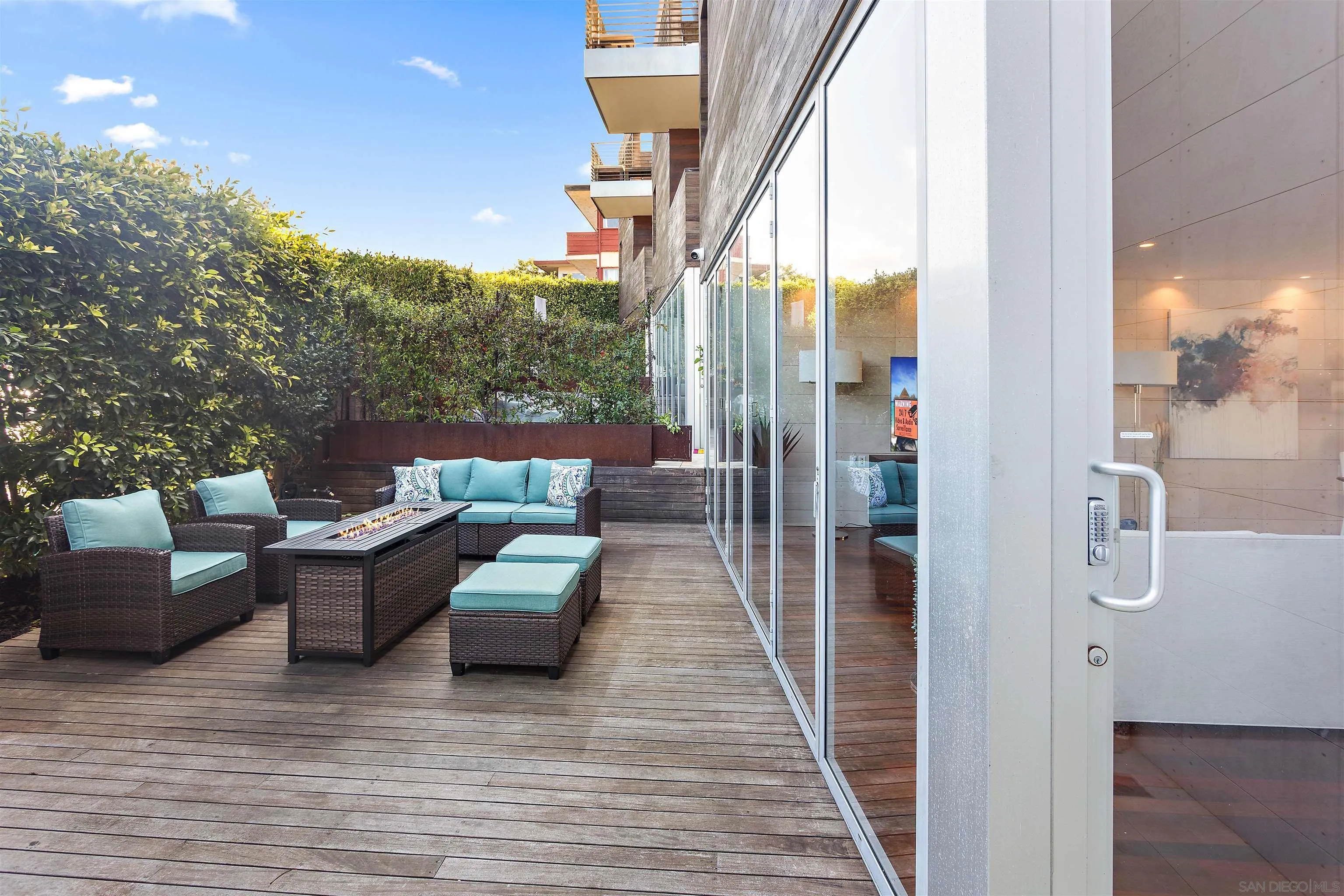 427 Ravina Street La Jolla, CA 92037 - Photo 25 of 36 a view of a balcony with couches and wooden floor