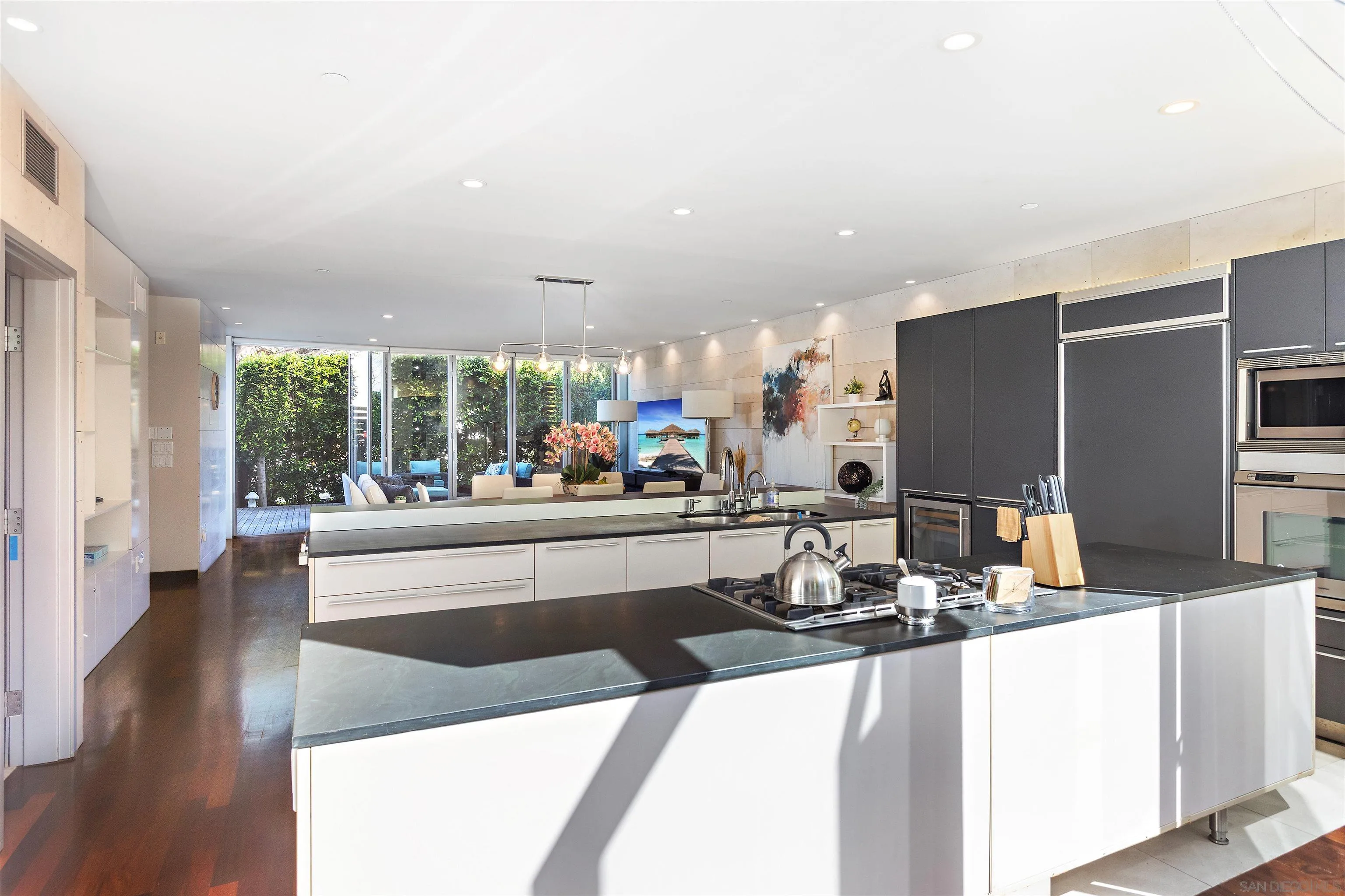 427 Ravina Street La Jolla, CA 92037 - Photo 27 of 36 a large kitchen with granite countertop a large counter top appliances and cabinets