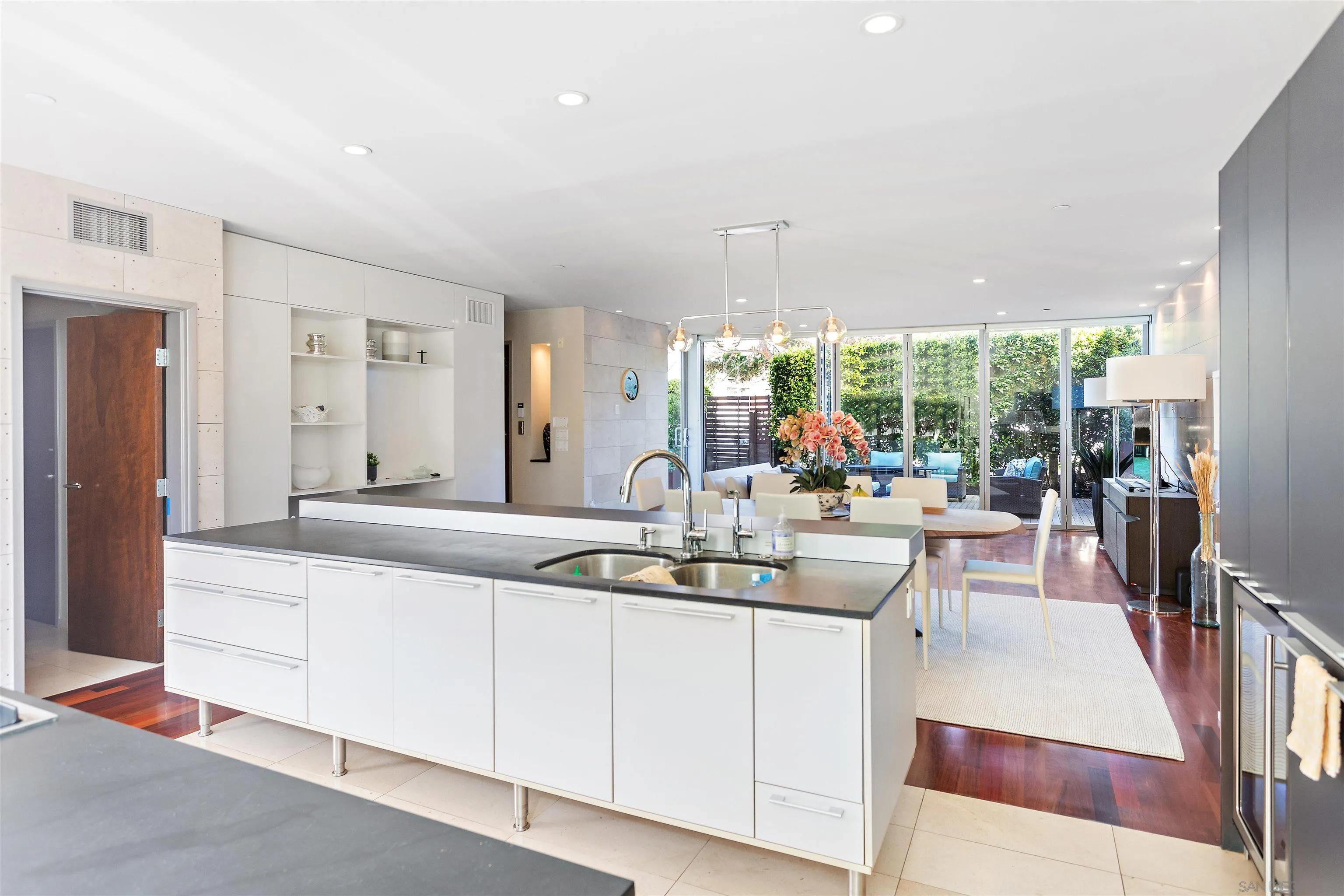 427 Ravina Street La Jolla, CA 92037 - Photo 28 of 36 a dining hall with stainless steel appliances kitchen island granite countertop a sink and cabinets
