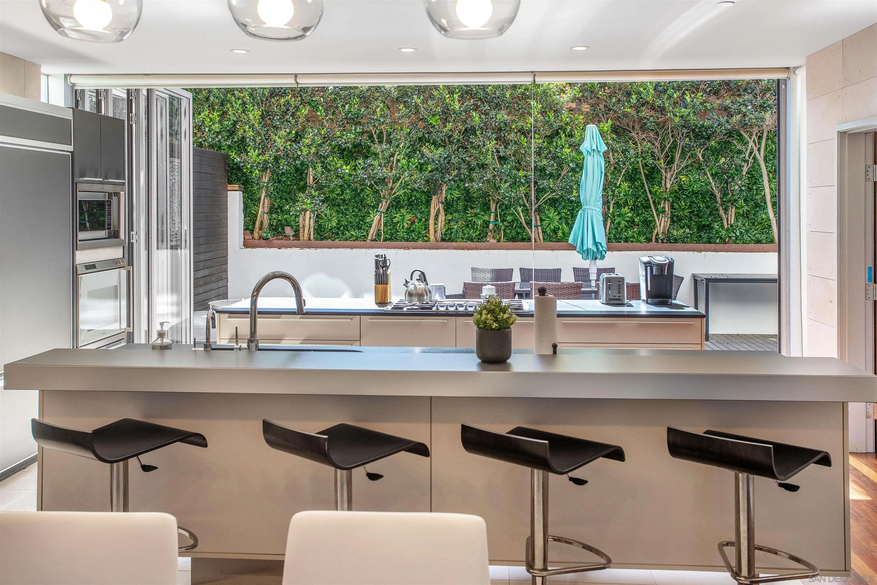 427 Ravina Street La Jolla, CA 92037 - Photo 4 of 36 a kitchen with a sink and a large window