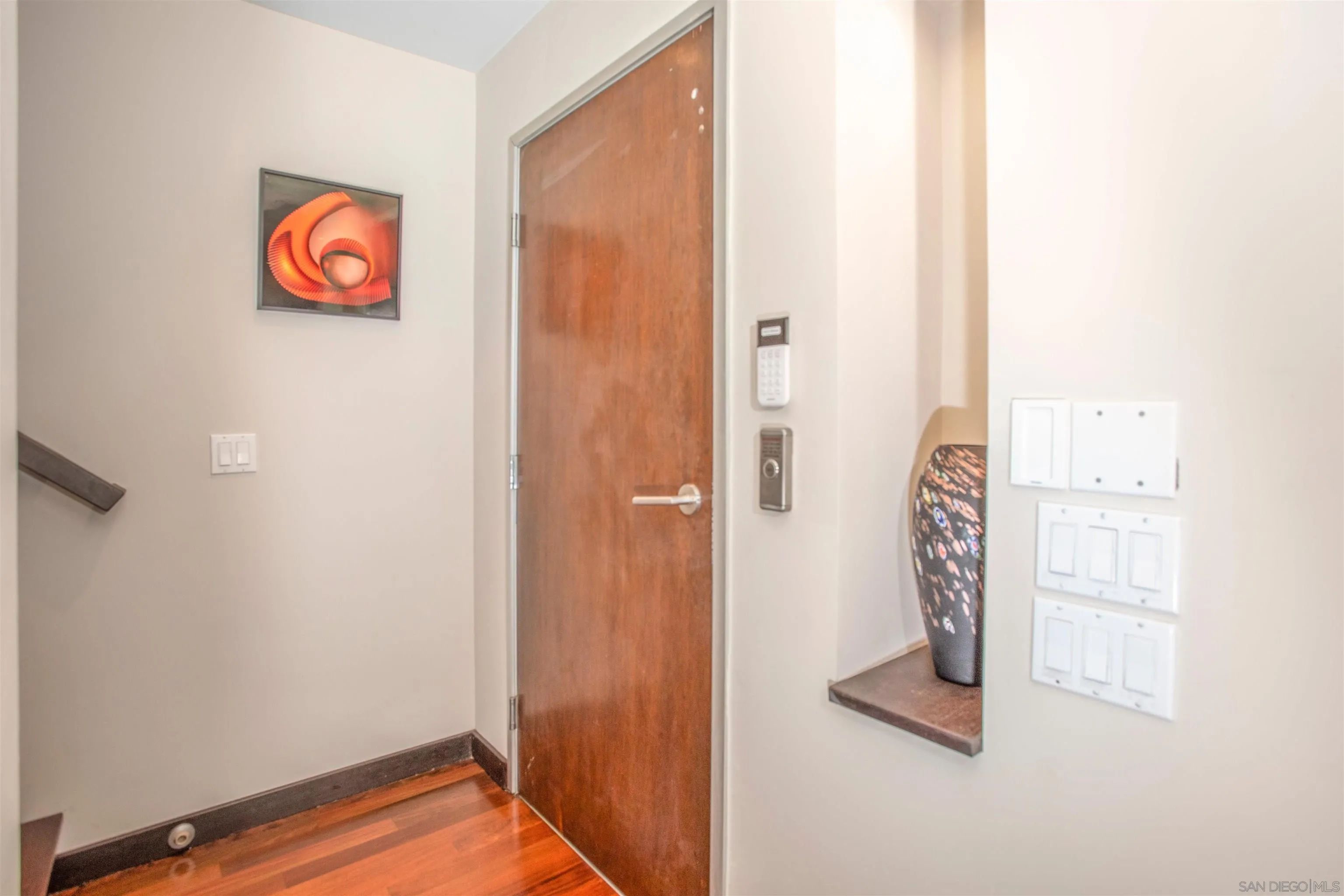 427 Ravina Street La Jolla, CA 92037 - Photo 9 of 36 a view of an entryway with wooden floor