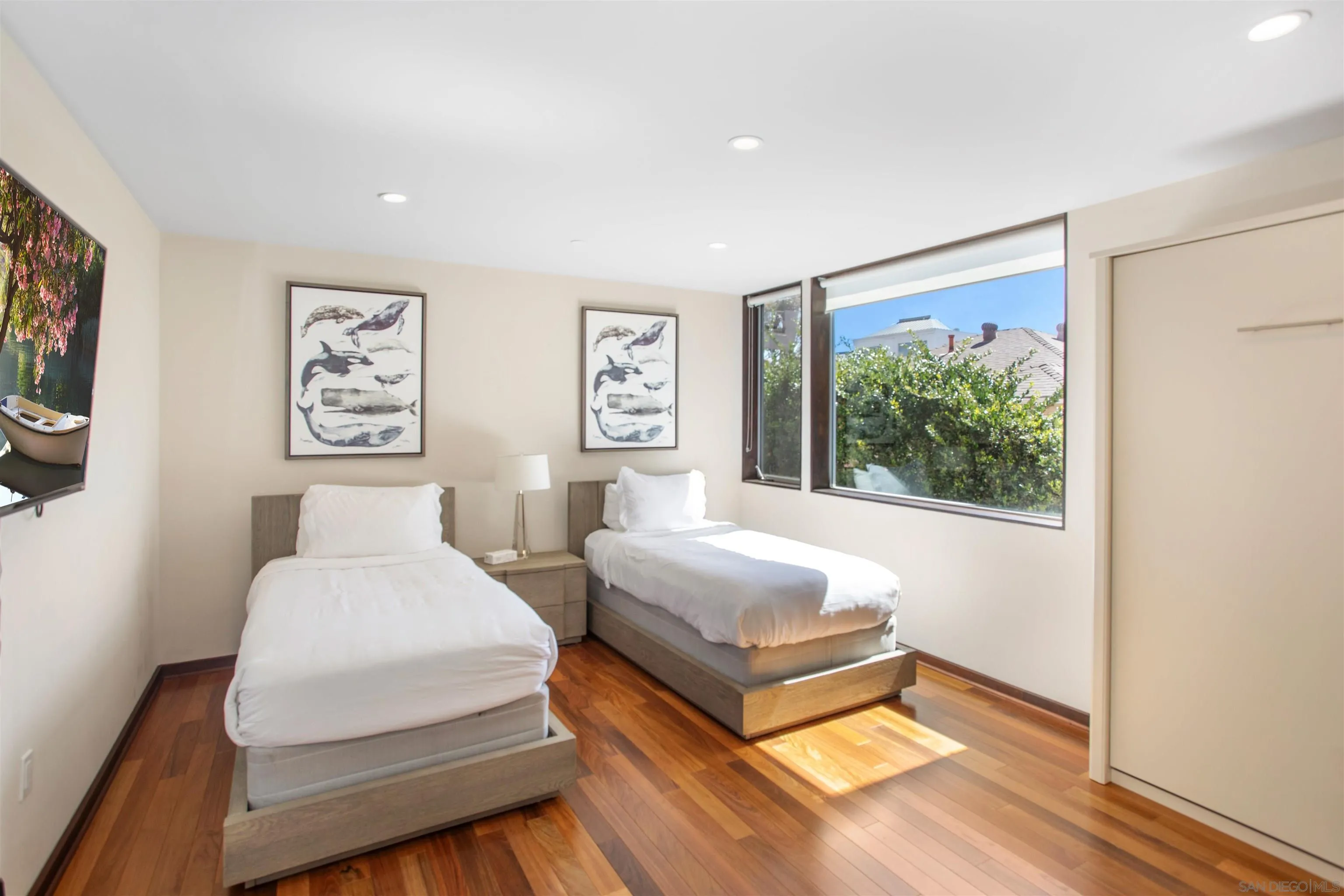 427 Ravina Street La Jolla, CA 92037 - Photo 10 of 36 a bedroom with a bed and a large window