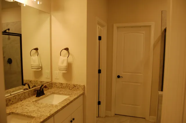 a bathroom with a glass shower door